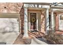 Townhouse front entrance with columns and wreath at 32 American Walk, Peachtree City, GA 30269