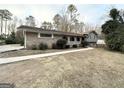 Ranch house with walkway, landscaping, and a large yard at 3138 Beechwood Dr, Lithia Springs, GA 30122