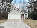 Two-car garage and stone accents at 3758 Riley Rd, Douglasville, GA 30134