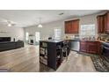 Inviting living room with an open-concept layout flowing into a spacious kitchen and featuring modern countertops at 319 Allegrini Dr, Atlanta, GA 30349