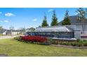 Independence community entrance with a fountain and landscaping at 300 Silver Moon Drive, Loganville, GA 30052