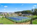 Community tennis courts with surrounding homes and green space at 300 Silver Moon Drive, Loganville, GA 30052