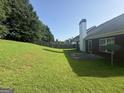Spacious backyard with a patio and grassy area at 235 Long Dr, Mcdonough, GA 30253