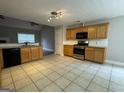 Kitchen with granite countertops and stainless steel appliances at 235 Long Dr, Mcdonough, GA 30253