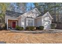 Charming single Gathering home with a red front door, mature landscaping, and an attached garage at 3700 Mays Sw Xing, Atlanta, GA 30331