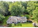 Aerial view showing a house, yard, and additional structures at 4995 Reservoir Dr, Douglasville, GA 30135