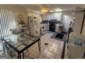 Eat-in kitchen with glass table and white cabinets at 6893 Mystic Ln, Morrow, GA 30260