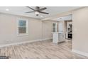 Open floor plan with kitchen island and laminate flooring at 1256 Elizabeth Sw Ave, Atlanta, GA 30310