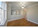 Bright dining room with hardwood floors and crown molding at 4879 Pinnacle Dr, Stone Mountain, GA 30088