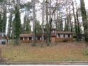 Brick ranch house with a large yard and mature trees. Needs some TLC at 3816 King Henry Sw Rd, Atlanta, GA 30331