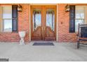 Ornate double doors with glass inserts at 145 Havenbrooke Ct, Fayetteville, GA 30214