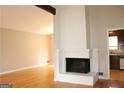 Living room with hardwood floors and a brick fireplace at 2405 Falls River Dr, Lithia Springs, GA 30122