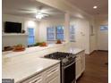 Modern kitchen featuring white cabinets, quartz countertops, and stainless steel appliances at 1420 Donnelly Ave, Atlanta, GA 30310