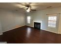 Living room with fireplace and hardwood floors at 4010 Peachtree Farms Rd, Rex, GA 30273