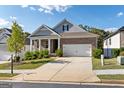 Curb appeal of a charming brick ranch home with a two-car garage at 113 Overlook Ridge Way, Canton, GA 30114