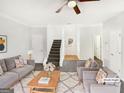This virtually staged living room features plush furniture and a cozy rug at 1535 Valley Club Dr, Lawrenceville, GA 30044