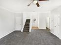 Bright living room featuring neutral paint, plush carpet, and ample natural light at 1535 Valley Club Dr, Lawrenceville, GA 30044