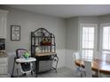 Kitchen features an island and white cabinets at 155 Carriage Gate Dr, Sharpsburg, GA 30277