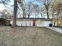 Updated Ranch house featuring a red front door at 157 Ruzelle Se Dr, Atlanta, GA 30354