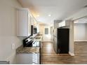 Modern kitchen with granite counters and stainless steel appliances at 157 Ruzelle Se Dr, Atlanta, GA 30354
