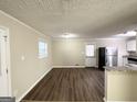 Open dining area with hardwood floors and access to kitchen at 60 Oak Sw Dr, Atlanta, GA 30354