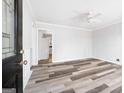 Living room with vinyl plank flooring and view into kitchen at 6559 Allatoona Rd # 19, Morrow, GA 30260