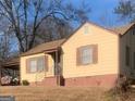 Yellow ranch home with carport, steps, and landscaping at 2276 Hillside Ave, Decatur, GA 30032