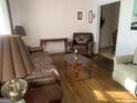 Living room with leather furniture and hardwood floors at 2276 Hillside Ave, Decatur, GA 30032