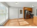 Kitchen with stainless steel appliances and laminate floors at 633 Westbridge Rd, Fayetteville, GA 30214
