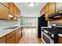 Functional kitchen featuring stainless steel appliances and ample cabinet space at 633 Westbridge Rd, Fayetteville, GA 30214