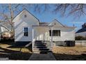 White house with gray steps leading to the front door at 2173 Anderson Se Ave, Covington, GA 30014