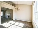Bright dining room with a chandelier and fireplace at 221 Stagecoach Pass, Temple, GA 30179