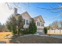 Two-story house with a brick facade and green shutters at 221 Stagecoach Pass, Temple, GA 30179