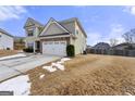 Rear view of a two-story house with a large backyard at 120 Emerson Trl, Covington, GA 30016
