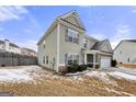 Side view of a two-story house with stone and siding at 120 Emerson Trl, Covington, GA 30016