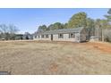 Newly built home with a detached shed at 234 Willis Rd, Sharpsburg, GA 30277
