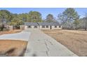 Ranch style home with a long driveway at 234 Willis Rd, Sharpsburg, GA 30277