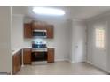 Modern kitchen featuring stainless steel appliances and wood cabinets at 1699 Redan West, Lithonia, GA 30058