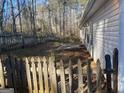 Backyard with wooden fence and patio at 216 Cane Se Ave, Social Circle, GA 30025