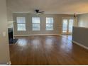 Spacious living room featuring hardwood floors and fireplace at 216 Cane Se Ave, Social Circle, GA 30025