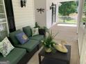 Spacious front porch with comfortable seating area at 35 Knights Dr, Covington, GA 30016