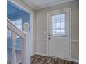Interior entryway with white door and staircase at 169 Holly Ct, Loganville, GA 30052