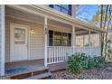 Front entrance with white railings and steps at 169 Holly Ct, Loganville, GA 30052