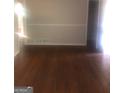 Bright dining room with hardwood floors and neutral walls at 2176 Lilac Ln, Decatur, GA 30032