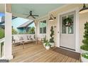 Relaxing front porch with seating area, creating a welcoming entryway at 11190 Serenbe Ln, Chattahoochee Hills, GA 30268