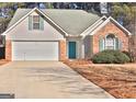 Brick and vinyl siding house with a two-car garage at 901 Arbor Way, Mcdonough, GA 30253