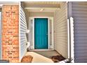 Teal front door entrance with sidelights at 901 Arbor Way, Mcdonough, GA 30253
