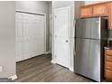 Spacious kitchen with stainless steel refrigerator and ample white pantry storage at 1455 Riverrock Ct, Riverdale, GA 30296