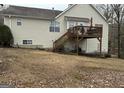 Elevated deck with stairs leading to the backyard, offering outdoor space at 228 Cornell Ct, Villa Rica, GA 30180