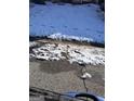 Snowy front yard with patches of grass visible at 2590 Wellington Walk Pl, Lithonia, GA 30058